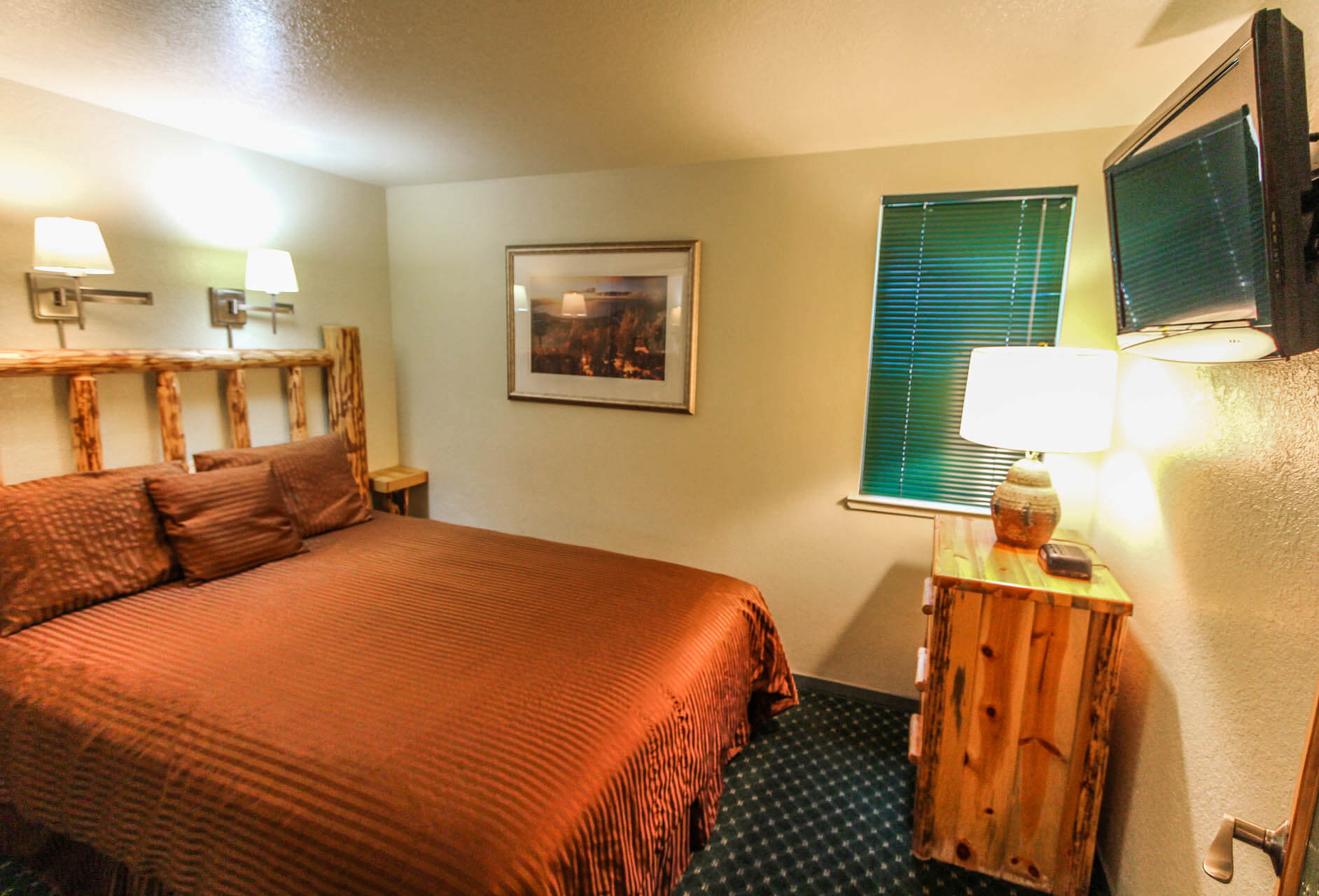 A cozy bedroom at VRI's The Lodge at Lake Tahoe in California.